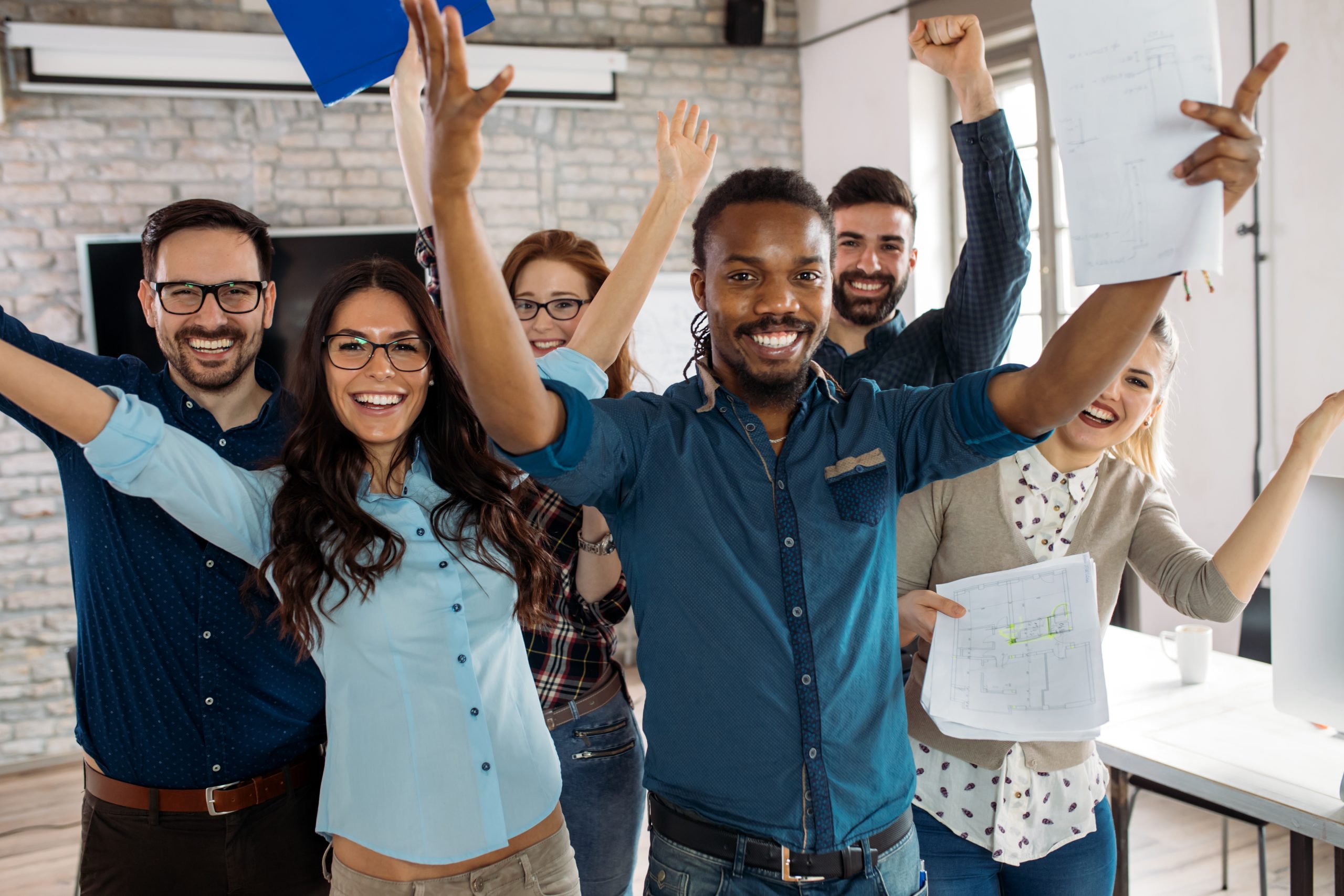 Happy successful company staff in office Life Science Talent Consultancy